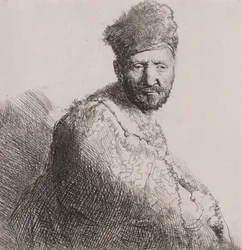 Hombre con barba en gorra y bata oriental