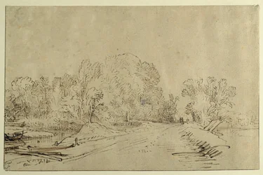Canal con barcos, un camino de dique y árboles