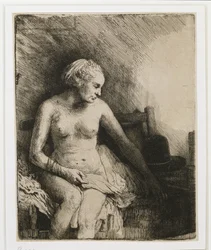 Una mujer en el baño con un sombrero a su lado, 1658