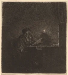Estudiante en una mesa a la luz de las velas