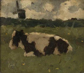 Vaca descansando con un molino