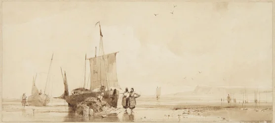 Barcos de pesca en las arenas de la costa de Normandía