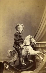 Niño sentado en un caballo de balancín, 1860s