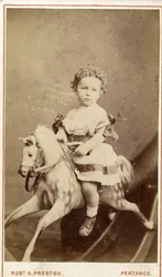 Niña sentada en un caballo de juguete, 1860s