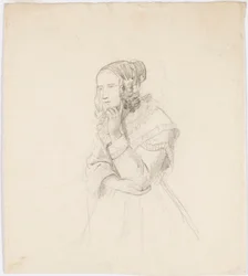 Mujer apoyando la barbilla en la mano izquierda