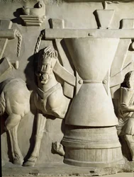 Arte romano: bajorrelieve que representa una rueda de molino. Siglo I d.C.
