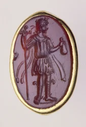 Intaglio engastado en un anillo de oro que representa una figura masculina joven, siglo II a.C.