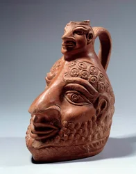 Arte romano: jarrón de terracota en forma de doble cabeza. París, Museo del Louvre