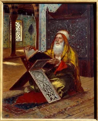 El escritorio Un imán leyendo el Corán