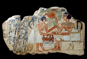 Antigüedad egipcia: estela de Iri en piedra caliza. Una pareja haciendo una ofrenda. Primer período intermedio (2200-2033 a.C.). París, museo del Louvre