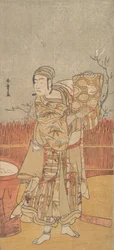 El actor Sawamura Sojuro III levantando un trozo de brocado