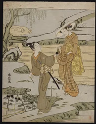 Escena de verano en un terraplén elevado de un joven cortando una berenjena para dársela a su joven compañera