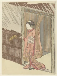 Chica con una rama de yamabuki en las manos.