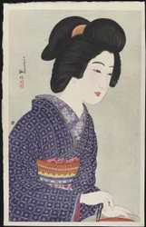 Mujer sentada junto a un brasero, febrero de 1925