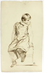 Niño sentado, mirando de lado