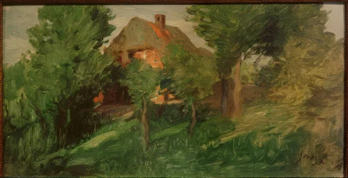Casa roja detrás de árboles