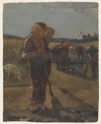 Agricultor de pie con una pala en el campo