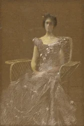 Dama en sillón de ratán