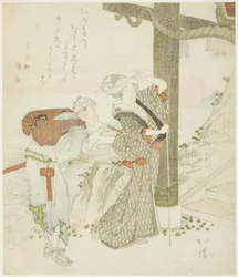 Mujer y asistente en la puerta de entrada de Enoshima