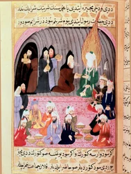 El profeta Muhammad (Muhammad o Muhammad) (570-632), con el rostro cubierto, en viaje a Siria, es recibido por monjes cristianos que le sirven una comida. Miniatura turca del siglo XVIII. Museo de Topkapi, Estambul, Turquía