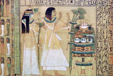 Un hombre y su esposa haciendo ofrendas a Osiris, del Libro de los Muertos egipcio