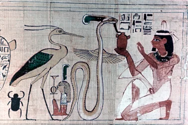 Papiro egipcio antiguo de la muerte arrodillada ante una serpiente