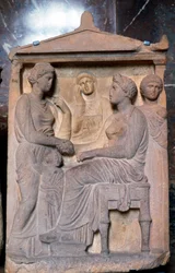 Relieve griego antiguo mostrando amigos saludándose