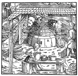 Separando plomo de plata u oro en un horno de copelación, 1556