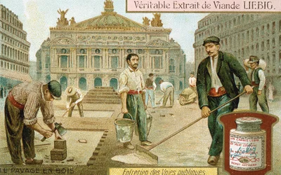 Pavimentando una calle de París con bloques de madera, c. 1900