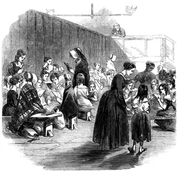 Enseñando a leer a las niñas en la escuela de la Unión Ragged, Lambeth, Londres, 1868