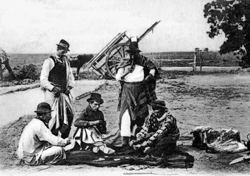 Tres hombres jugando a las cartas, Uruguay, c1900s