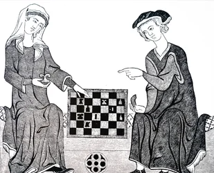 Un hombre y una mujer jugando ajedrez