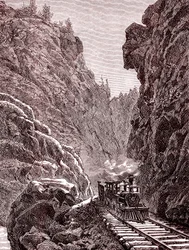 Un tren cruzando las montañas de Colorado. EE.UU. en 1886 (grabado)
