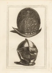 Antiguo casco morrión veneciano ornamentado con trofeos militares, y un casco burgonet con visera y babera unificadas de la Torre de Londres