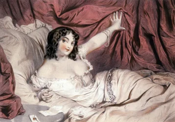 Mujer desnuda en la cama