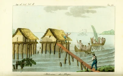 Casas sobre pilotes en el océano en la isla de Rawak, Papúa Nueva Guinea