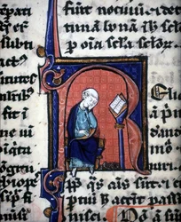 Una letra miniatura "R" que representa a un sabio, tomada de un manuscrito de Aristóteles