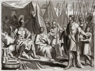 Biblia de Royaumont, Antiguo Testamento: Holofernes. General del ejército de Nabucodonosor II, Holofernes se acerca a Judea. Ahior, rey de los amonitas, que vino a devolverle, levanta ante Holofernes el poder del Dios de los judíos. Ilustración de 1811.