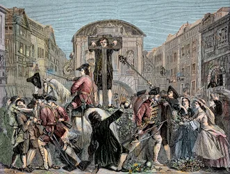 Daniel Defoe (De Foe) (1659-1731) en el cepo en Londres en 1703 por publicar su tratado irónico "The Shortest Way With the Dissenters" - El escritor y aventurero Daniel Defoe (1659-1731) condenado en 1703 al cepo por sus escritos contra la int