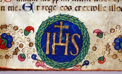 Símbolo cristiano IHS cuyo significado es Jesús. Manuscrito del siglo XV.