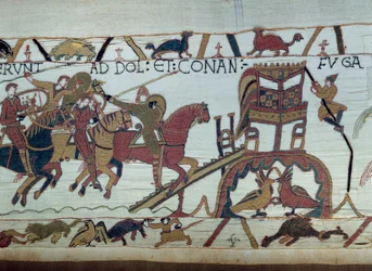 Los ejércitos de Guillermo el Conquistador (1027-1087) fueron a luchar contra el Duque de Bretaña, llegaron a Bayeux. Harold acaba de ser nombrado caballero por Guillermo (detalle) Tapiz de Bayeux o Bordado de la Reina Matilde