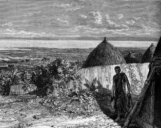Pueblo en las orillas del lago Alberto Nyanza (o lago Alberto), África. Grabado en “El diario de la juventud”