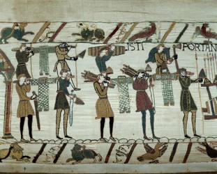 Armas y vino son llevados a los barcos durante el reabastecimiento para la conquista de Inglaterra por las flotas de Guillermo el Conquistador en 1066. Detalle del tapiz de Bayeux o Bordado de la Reina Matilde.