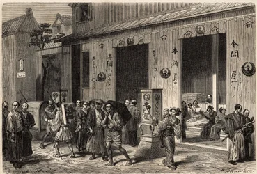 Una librería, con pilas de libros y lectores, en Yedo (o Edo, actual Tokio), abierta en una calle animada. Grabado para ilustrar el viaje a Japón, en 1863-1864, por Aime Humbert, ministro de la Confederación Suiza, en "Le tour du monde, nouveau jou