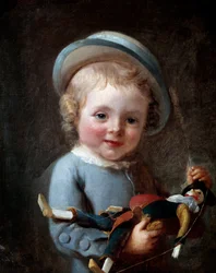 El pequeño niño con el muñeco