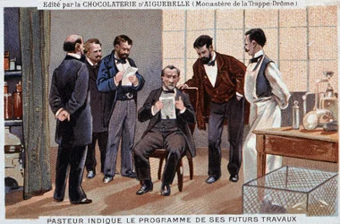 Louis Pasteur, un científico francés (1822-1895), indicó el programa de su futuro trabajo, rodeado de colaboradores - etiqueta publicitaria de chocolate de Aiguebelle, v. 1895