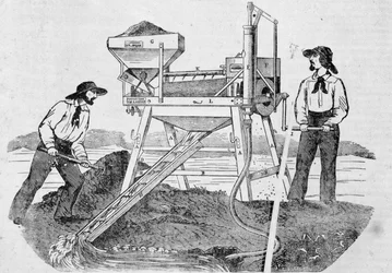Publicidad “The Fortune, Company of the Gold Mines of California”: imagen que representa a dos buscadores de oro trabajando en máquinas de lavado y mezclando oro - en “el Charivari” del 25 de junio