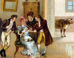 El médico inglés Edward Jenner (1749-1823) inocula la viruela en el brazo de un niño para vacunarlo. La vaca de la que se tomó el suero está al fondo. Cromolitografía del siglo XIX.