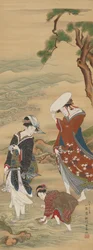 Dos mujeres y una niña en la orilla del mar