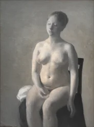 Desnudo femenino sentado
